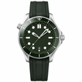 Diver style watch with dark green dial and rubber strap on white background