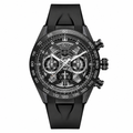 Sport chronograph watch with black rubber strap and dark mechanical dial on white background