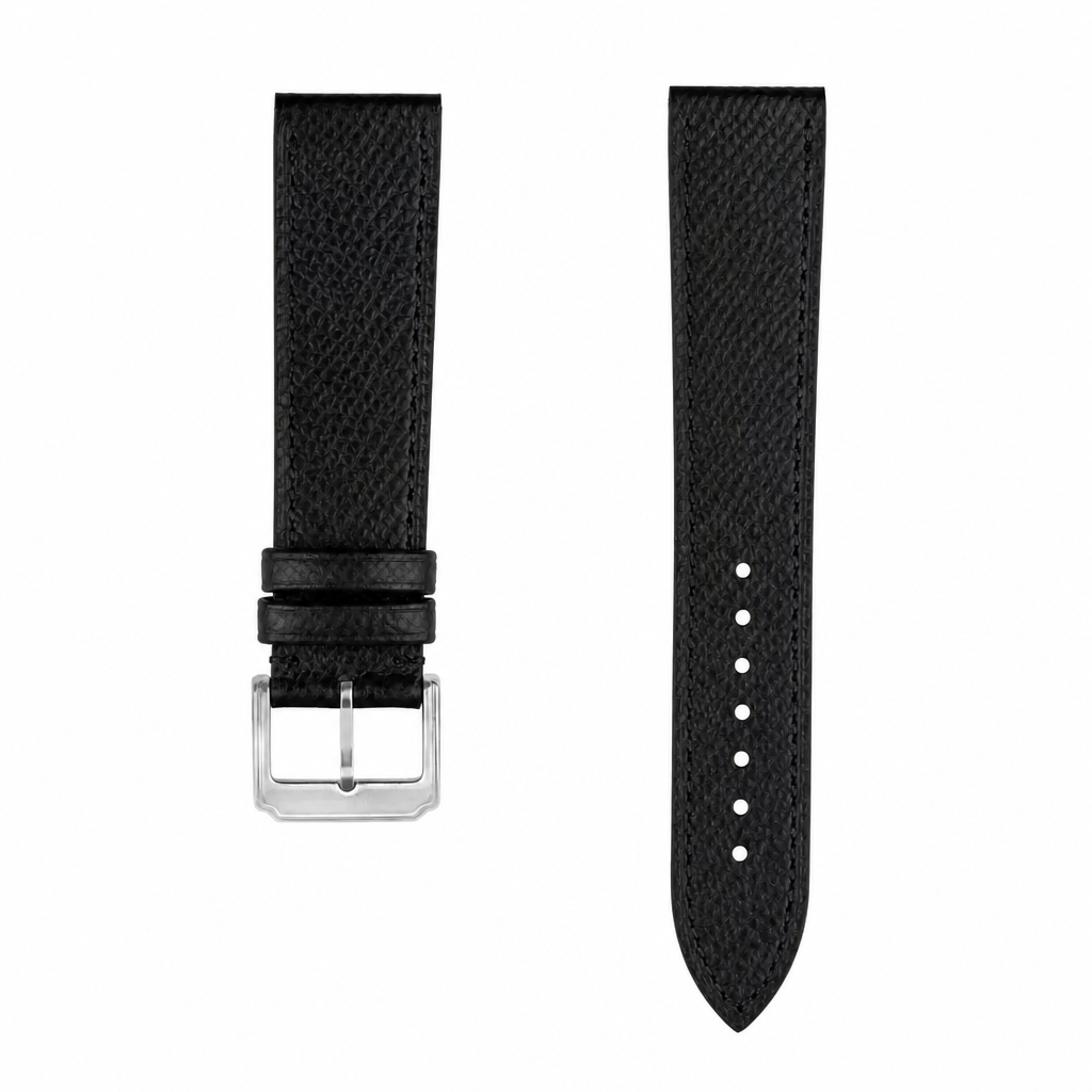 Black leather watch strap with silver buckle on white background
