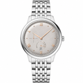 Dress watch with light silver dial and silver stainless steel bracelet on white background