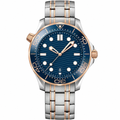 Two-tone diver watch with blue dial and bezel on metal bracelet