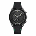 Chronograph watch with black dial and black rubber strap featuring green stitching