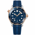 42mm diver watch with blue dial, two-tone metal case, and blue rubber strap