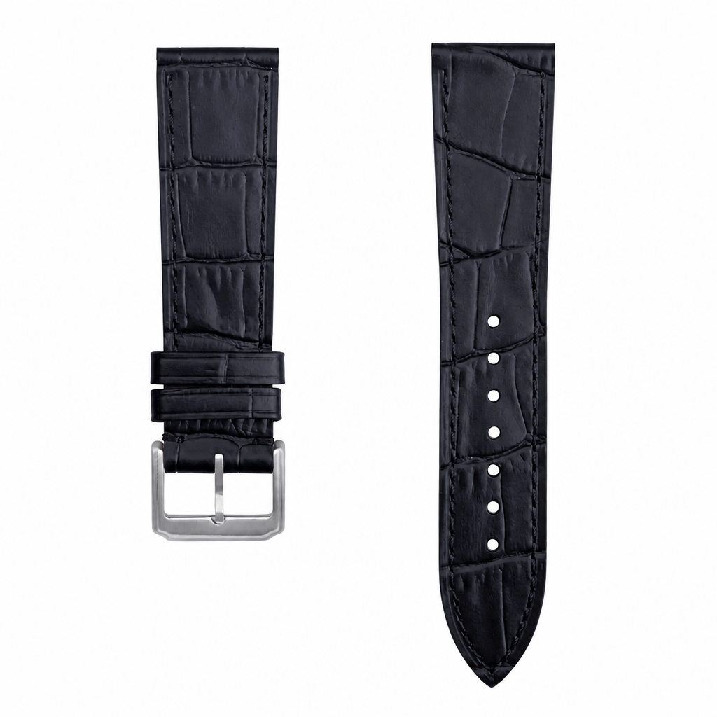 Black embossed leather watch strap with silver buckle on white background