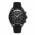 Chronograph watch with black dial, three subdials, dark metal case, and black suede strap on white background