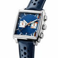 Square chronograph watch with blue dial, silver stainless steel case, and perforated blue leather strap on white background