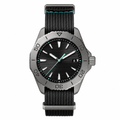 Men's sport watch with black dial, gray titanium case, and black textile strap with blue stitching