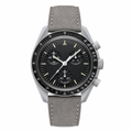 Chronograph watch with black dial and gray suede strap on white background