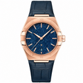 Men's dress watch with blue dial and rose gold tone case on blue leather strap