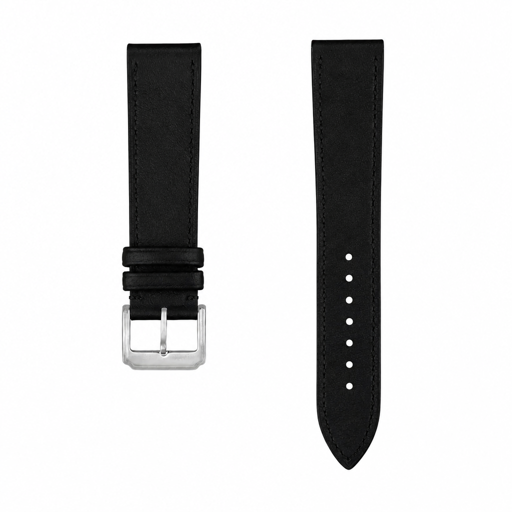 Black leather watch strap with silver buckle on white background