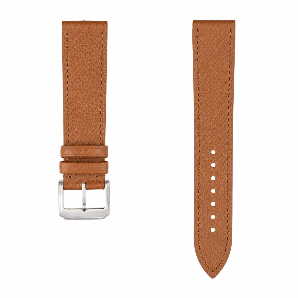 Brown leather watch strap with silver buckle on white background