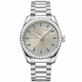 Elegant dress watch with silver case and bracelet, gray dial with blue markers, and embellished bezel